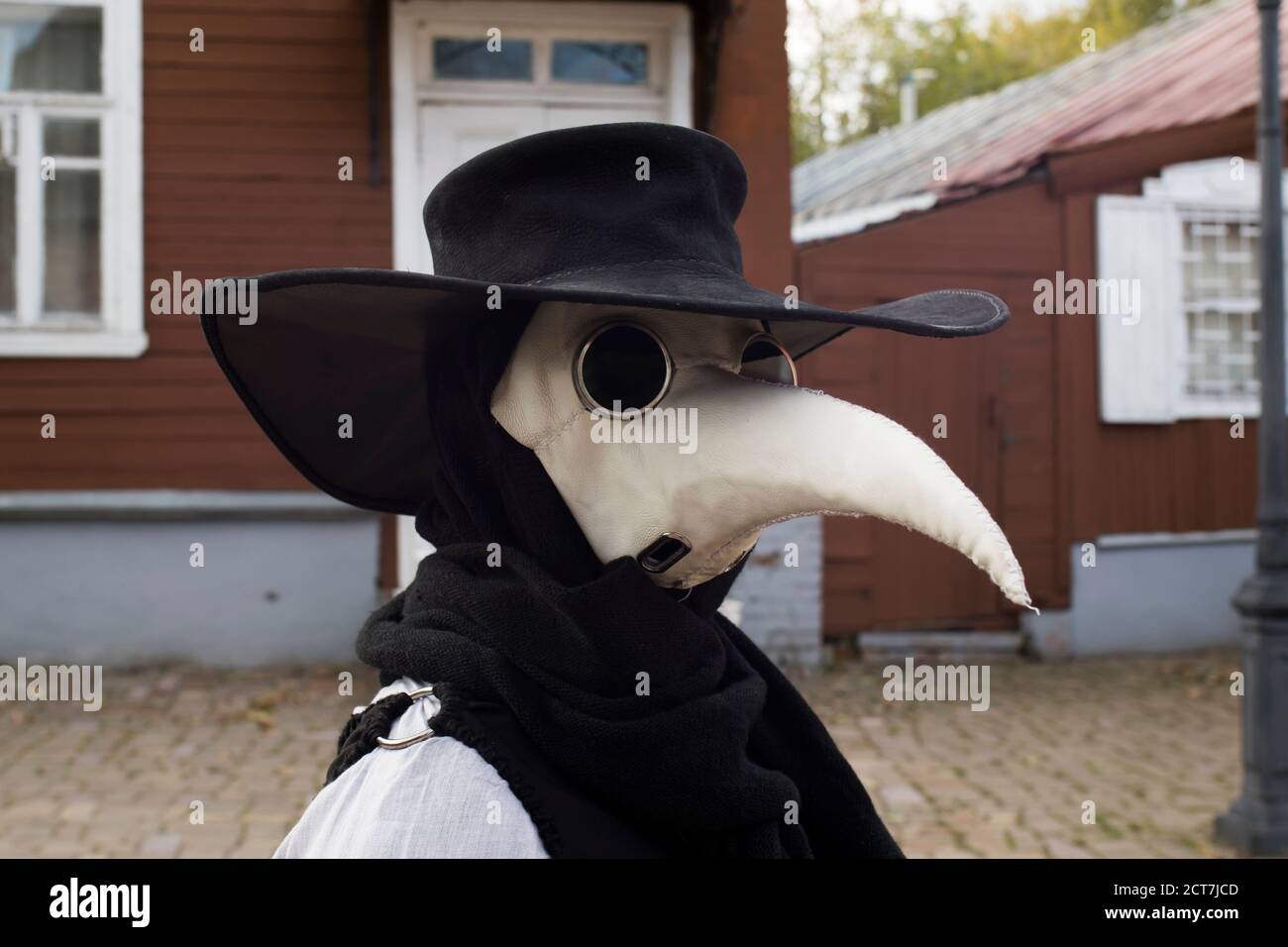 Modern stylized plague doctor in leather mask Stock Photo - Alamy
