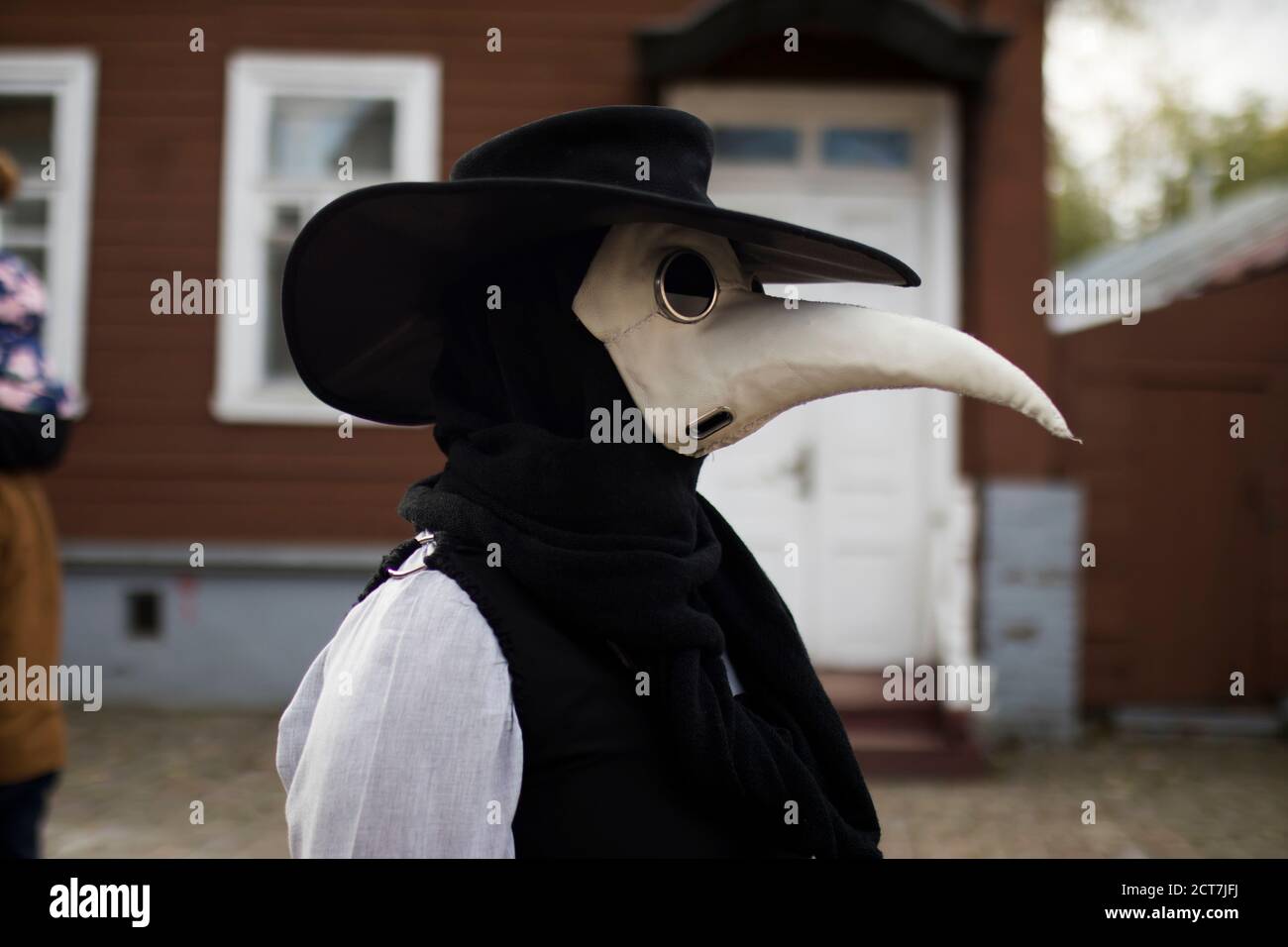 Modern stylized plague doctor in leather mask Stock Photo - Alamy
