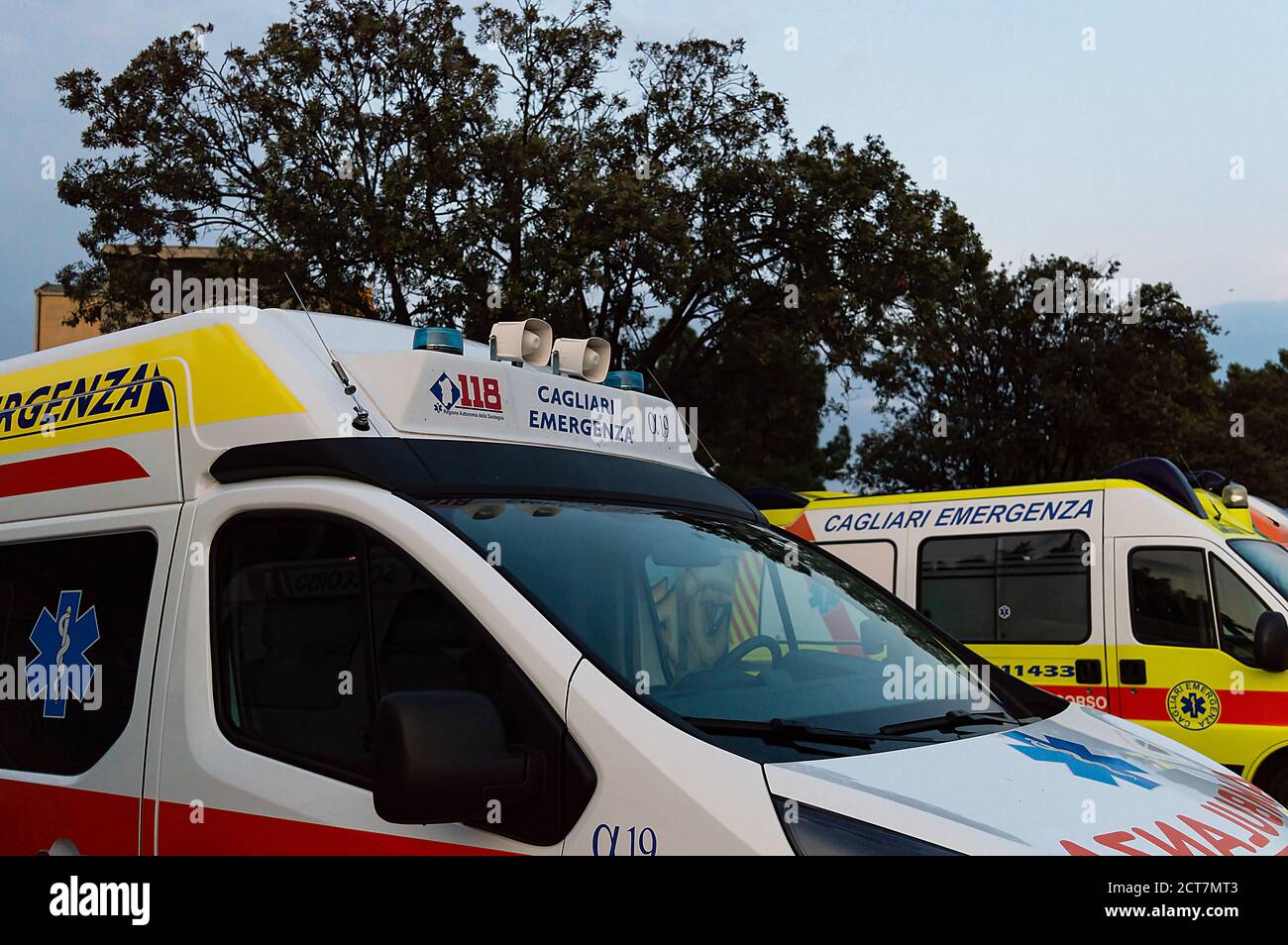 Some ambulances parked in a city area Stock Photo