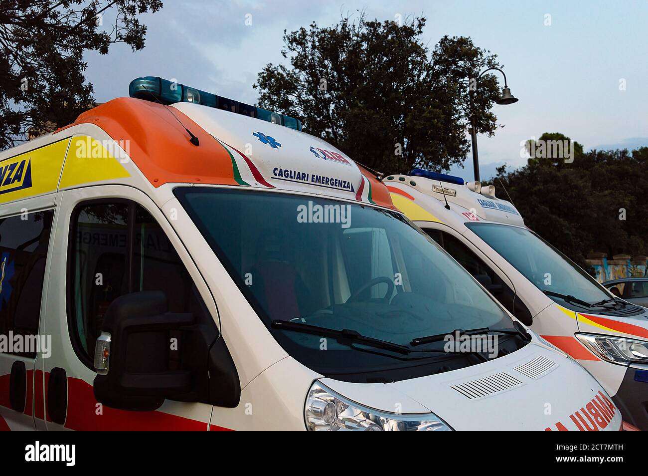 Some ambulances parked in a city area Stock Photo