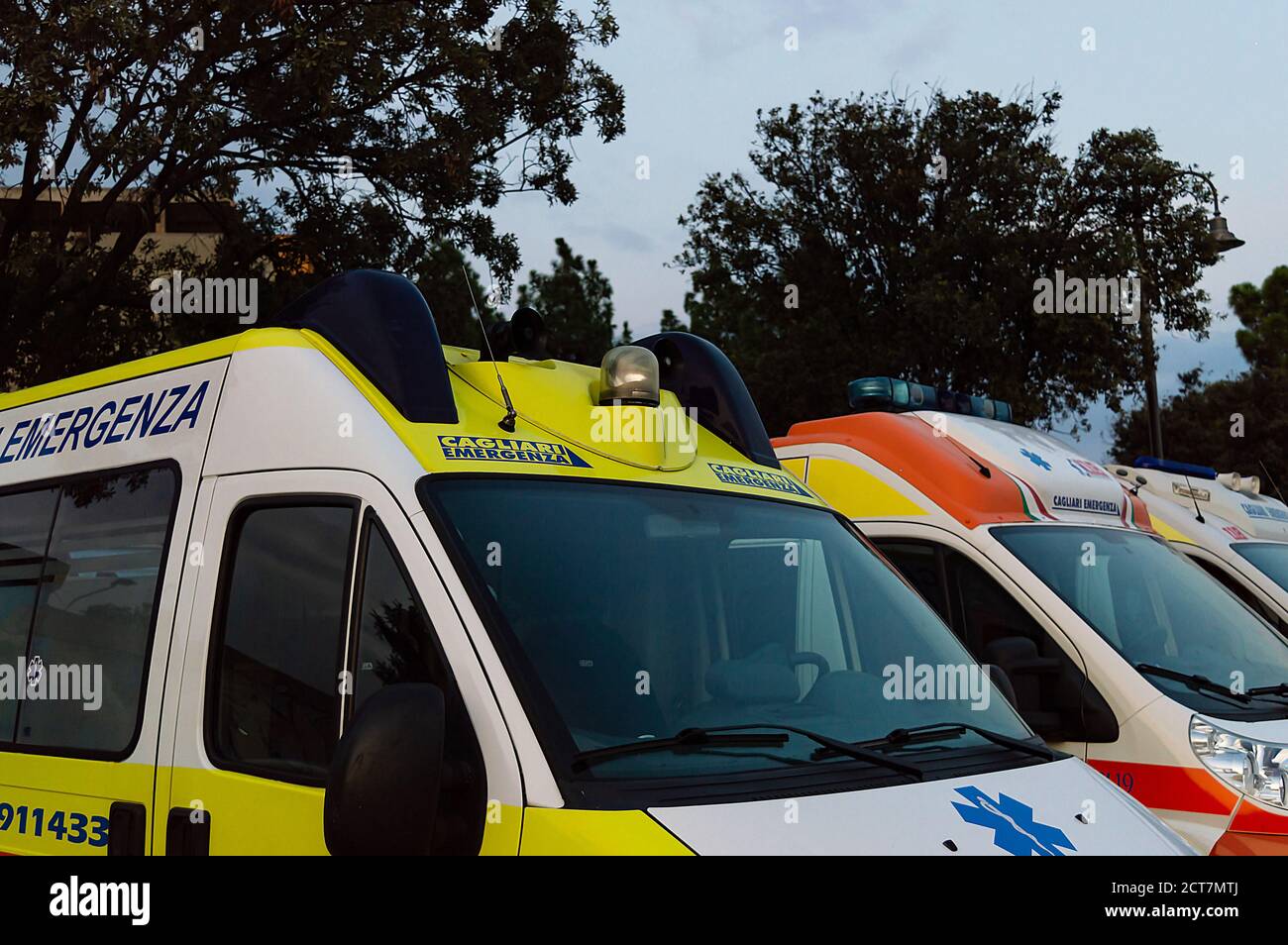 Some ambulances parked in a city area Stock Photo