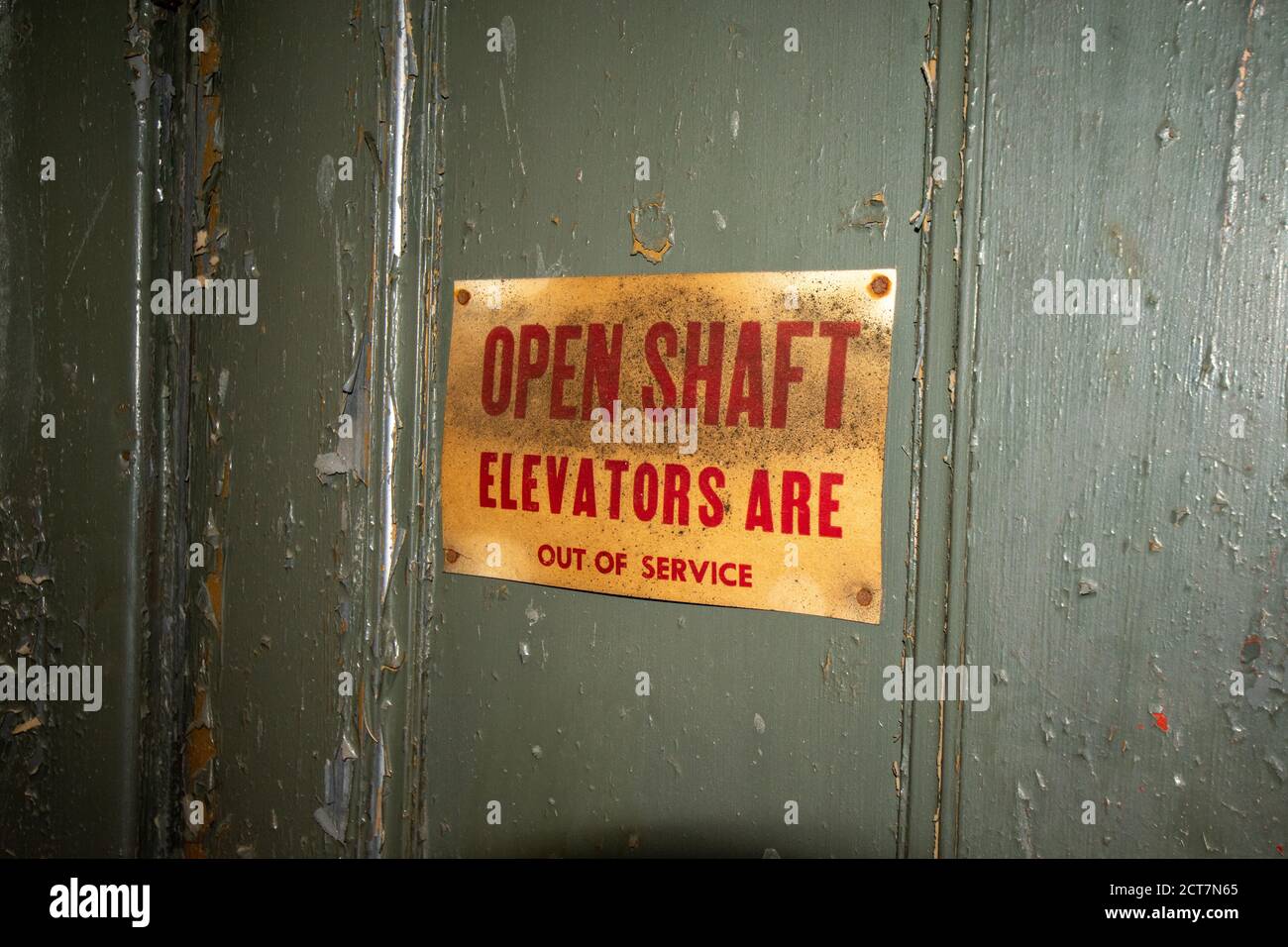 A Door to an Out of Service Elevator With an Open Shaft Stock Photo