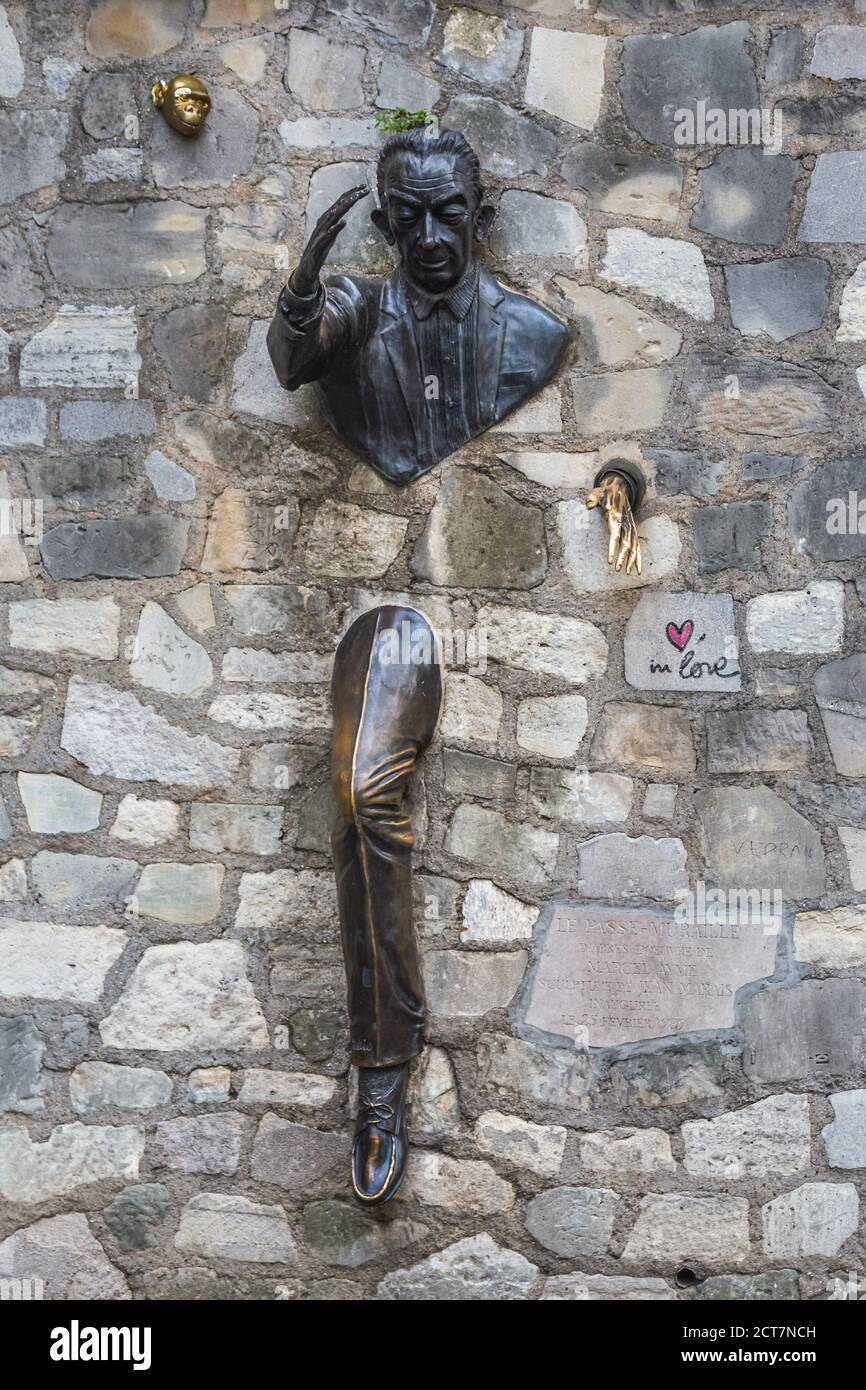 Bronze sculpture: man walking through the wall, based on the story of the same name, written by french writer Marcel Aime in 1943. One of the main sig Stock Photo