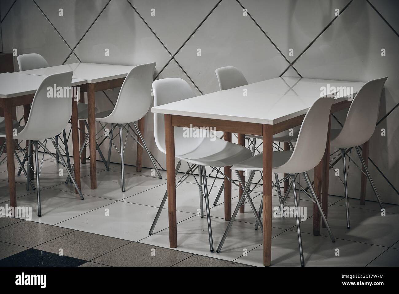 White stools and white tables at cafe Stock Photo