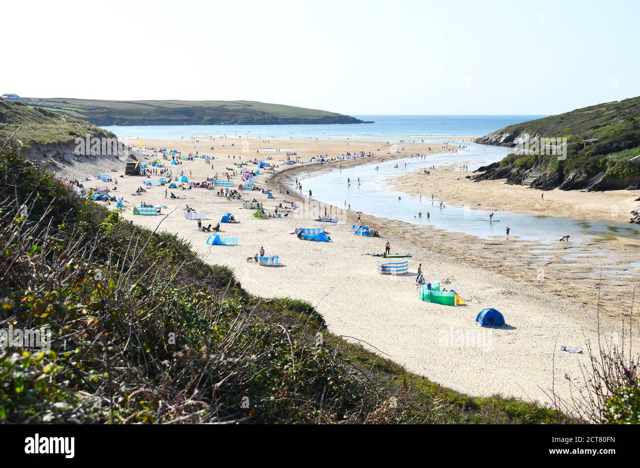 Gannel Estuary, Newquay, Cornwall, UK - September 17 2020: At Crantock beach people are enjoying the sandy beach next to the river Gannel in the sun. Stock Photo