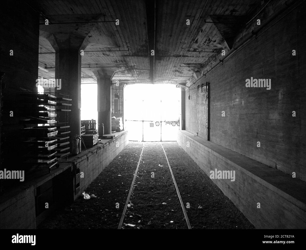Black and white archival 2003 view of railroad loading dock inside old historic Warehouse One which is owned by Port of Los Angeles in Southern California. Stock Photo