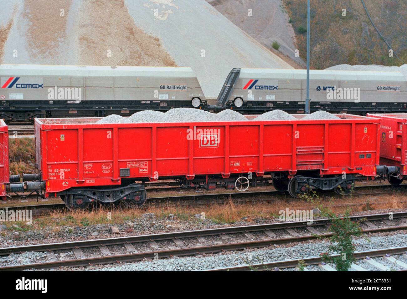 Buxton, UK - 16 September 2020: The DB (Deutsche Bahn) and GB Railfreight wagons for carrying stone at Peak Dale railway yard. Stock Photo