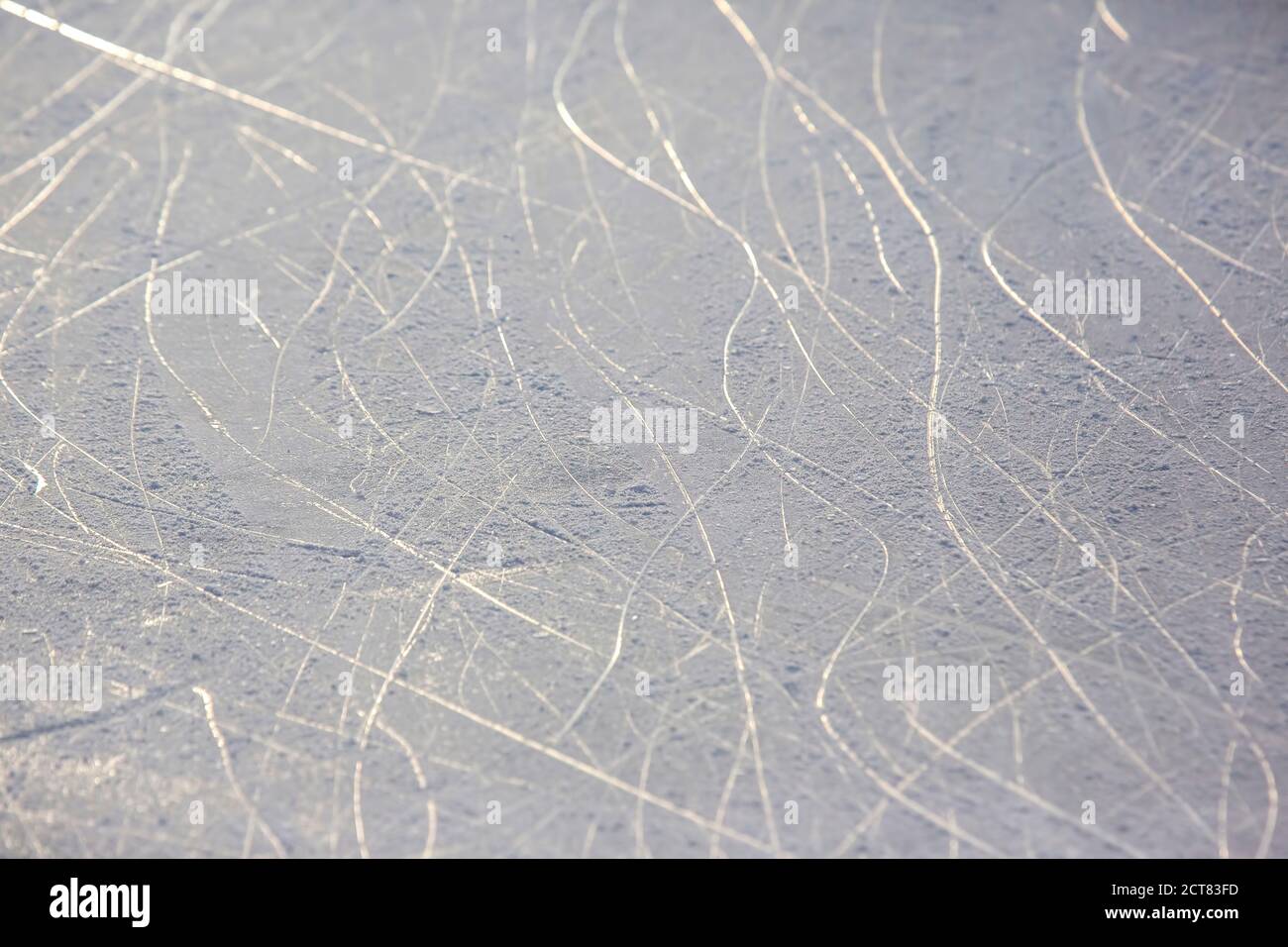 bright traces of ice skating on an ice rink. background and texture Stock Photo