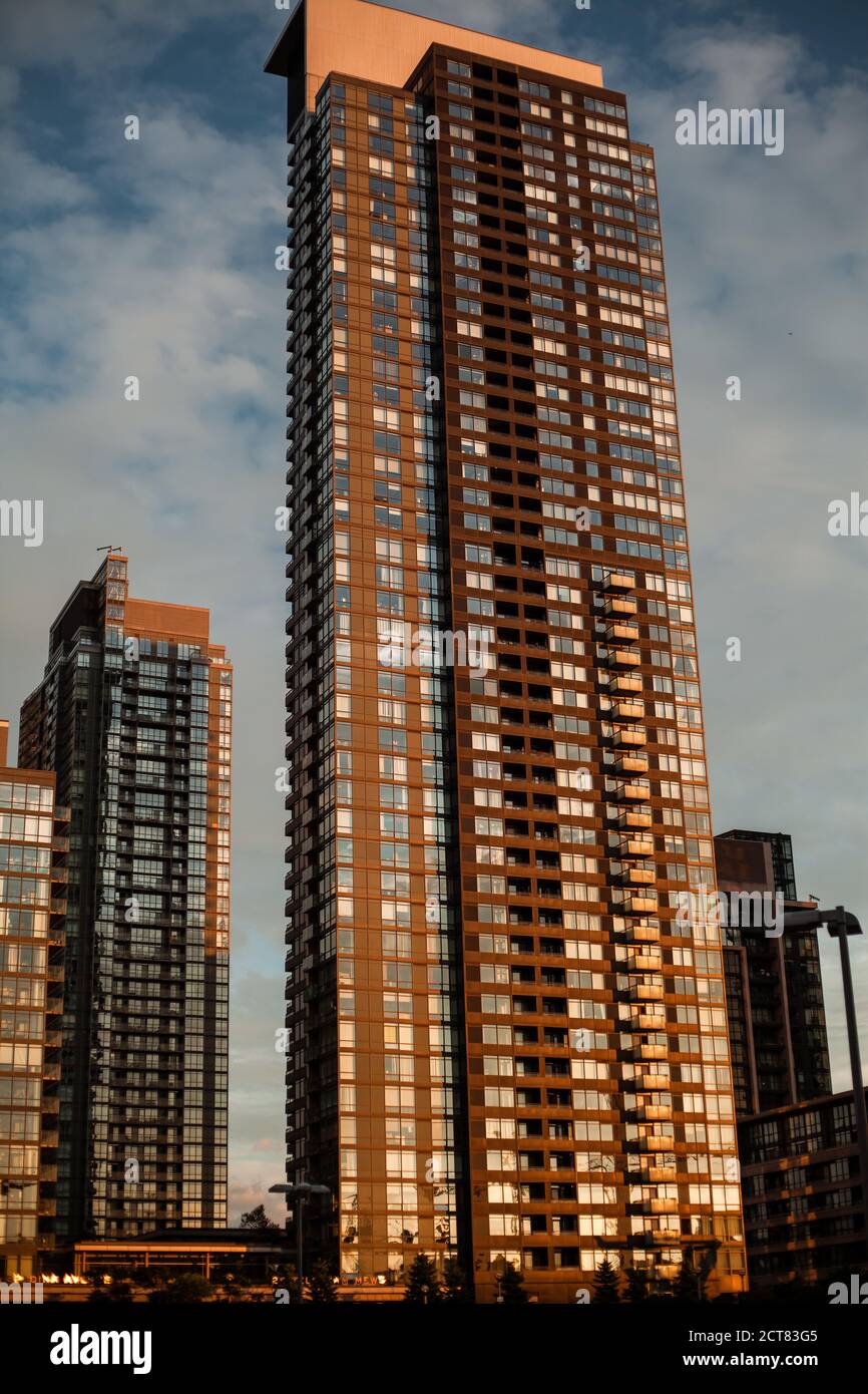 Vertical shot of tall modern glass buildings Stock Photo - Alamy