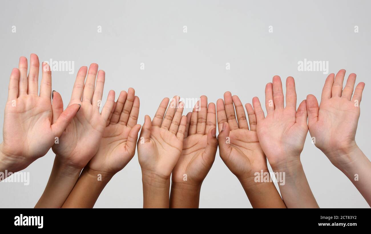 Hands kids up multiracial hi-res stock photography and images - Alamy