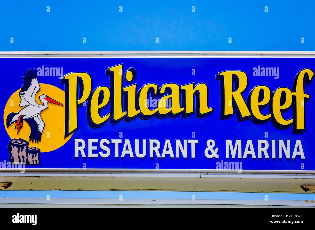 A sign advertises Pelican Reef restaurant and marina, Aug. 22, 2020, in Theodore, Alabama. The sign was destroyed during Hurricane Sally on Sept. 16. Stock Photo
