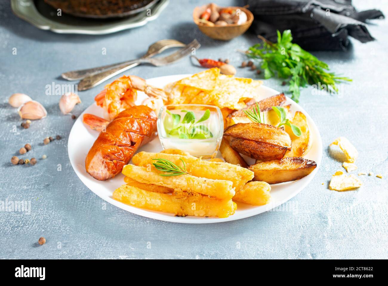 fried potato sausage shrimp and cheese sticks Stock Photo
