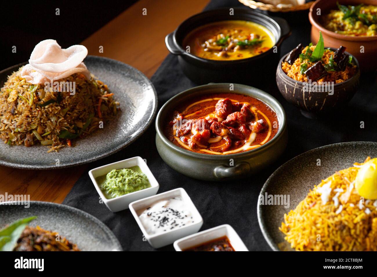 Delicious Sri Lankan cuisine table setting in restaurant venue Stock