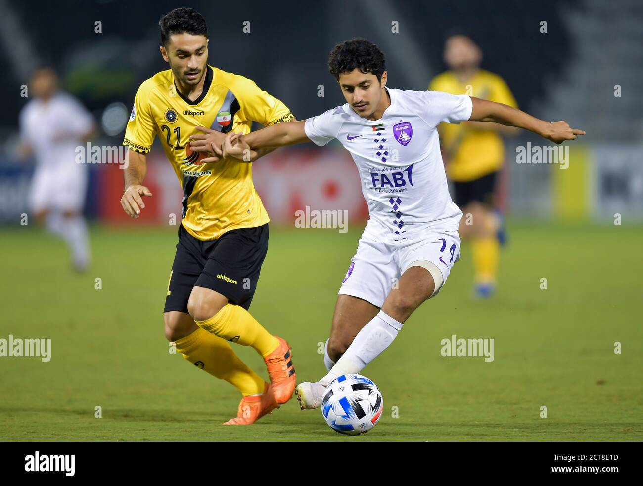 Doha, Qatar. 21st Sep, 2020. Rayan Yaslam (R) of Al Ain FC vies