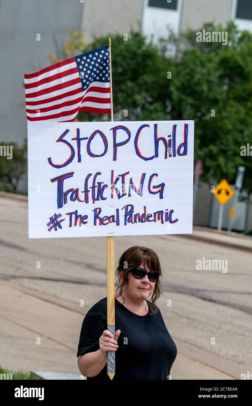 St. Paul, Minnesota. August 22, 2020. Save our children protest.  Protester holding a stop child trafficking sign. Stock Photo