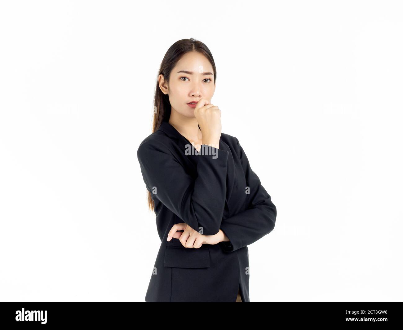 Portrait of serious young pretty Asian businesswoman in black suit ...