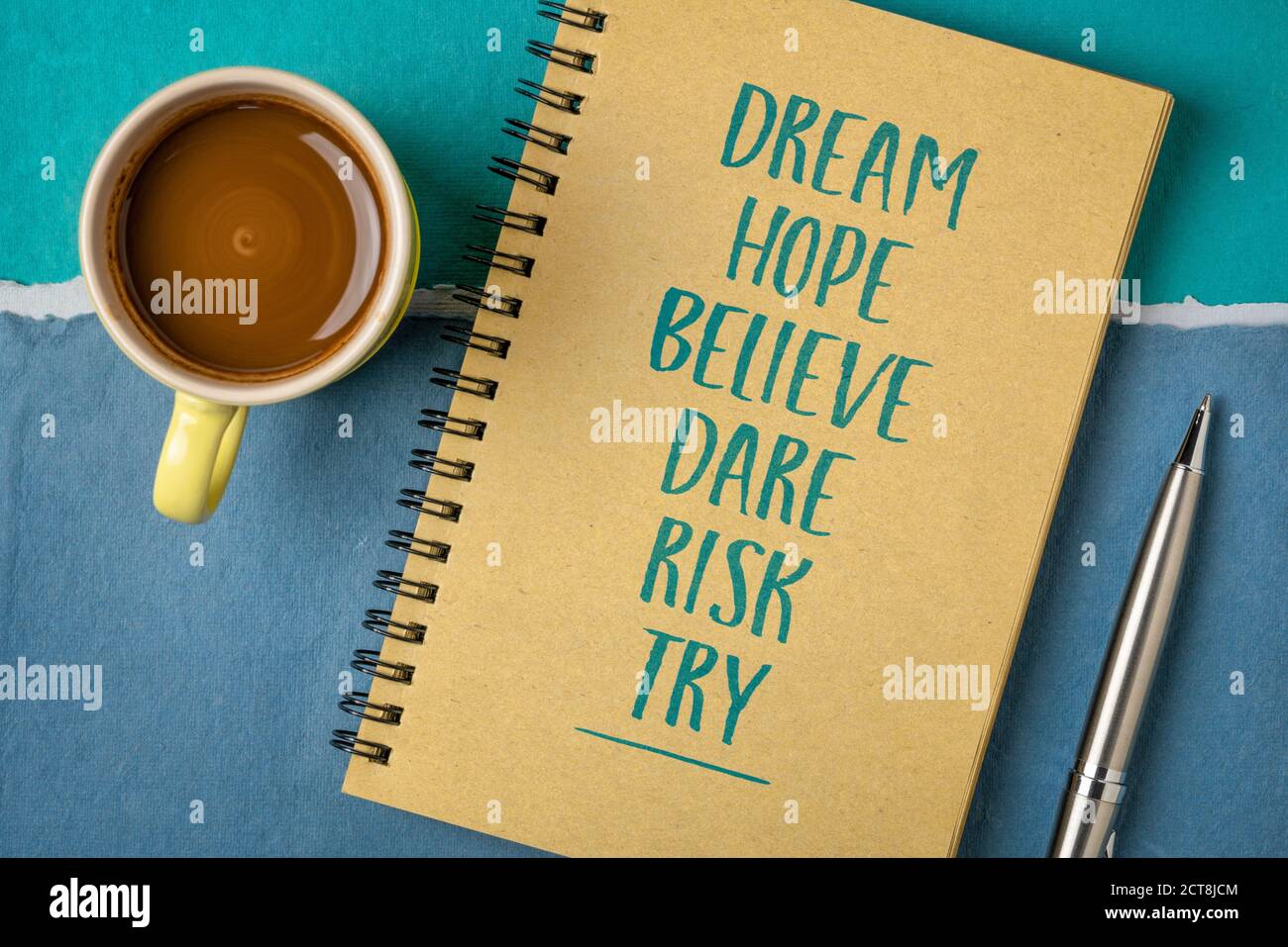 dream, hope, believe, dare, risk, try - creativity, inspirational and motivational concept, personal development,  handwriting in a spiral sketchbook Stock Photo