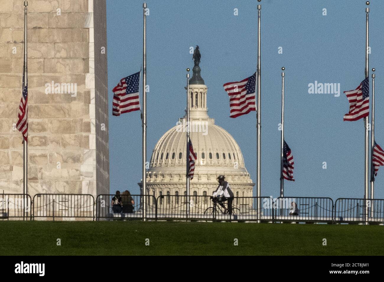Washington, United States. 21st Sep, 2020. The U.S. Capitol is seen between the flags that are at half mast at the Washington Monument in honor of Supreme Court Justice Ruth Bader Ginsburg on Monday, September 21, 2020 in Washington, DC. Ginsburg died on Saturday, September 19th and will lie in state at the U.S. Capitol on Friday, September 25, 2020. Photo by Pat Benic/UPI Credit: UPI/Alamy Live News Stock Photo