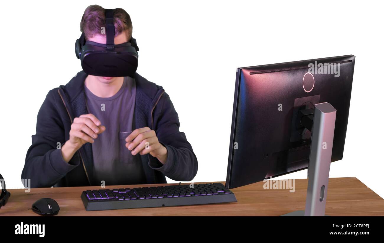 Gamer boy playing with VR headset on white background. Stock Photo