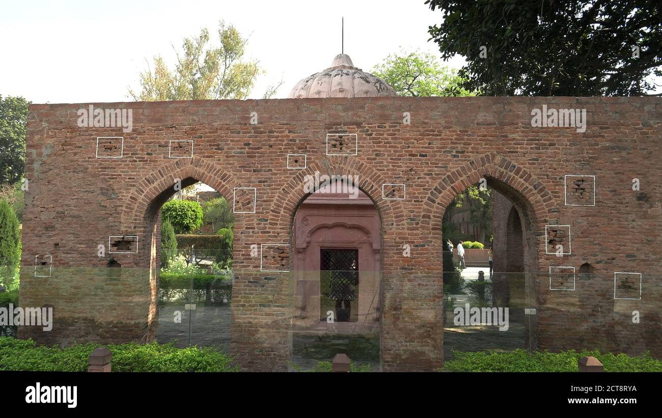 wide view of a bullet marked wall at jallianwala bagh memorial in amritsar, india Stock Photo