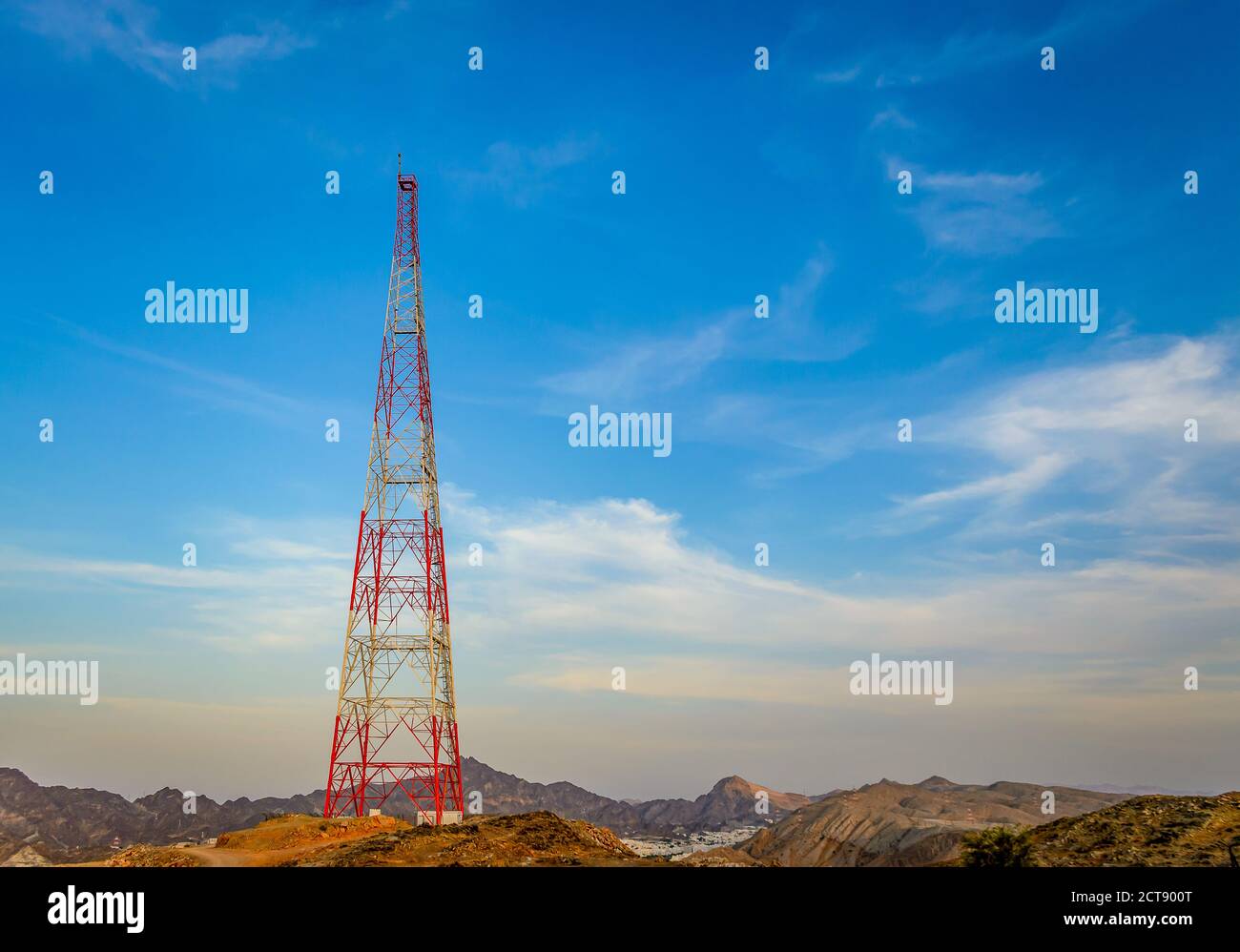 Mobile Tower on top of a mountain with a clear blue sky in the background. From Muscat, Oman. Stock Photo