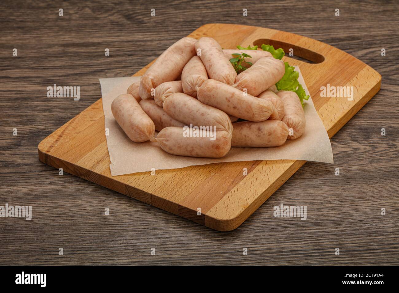 Raw natural chicken baby sausages for roast Stock Photo Alamy