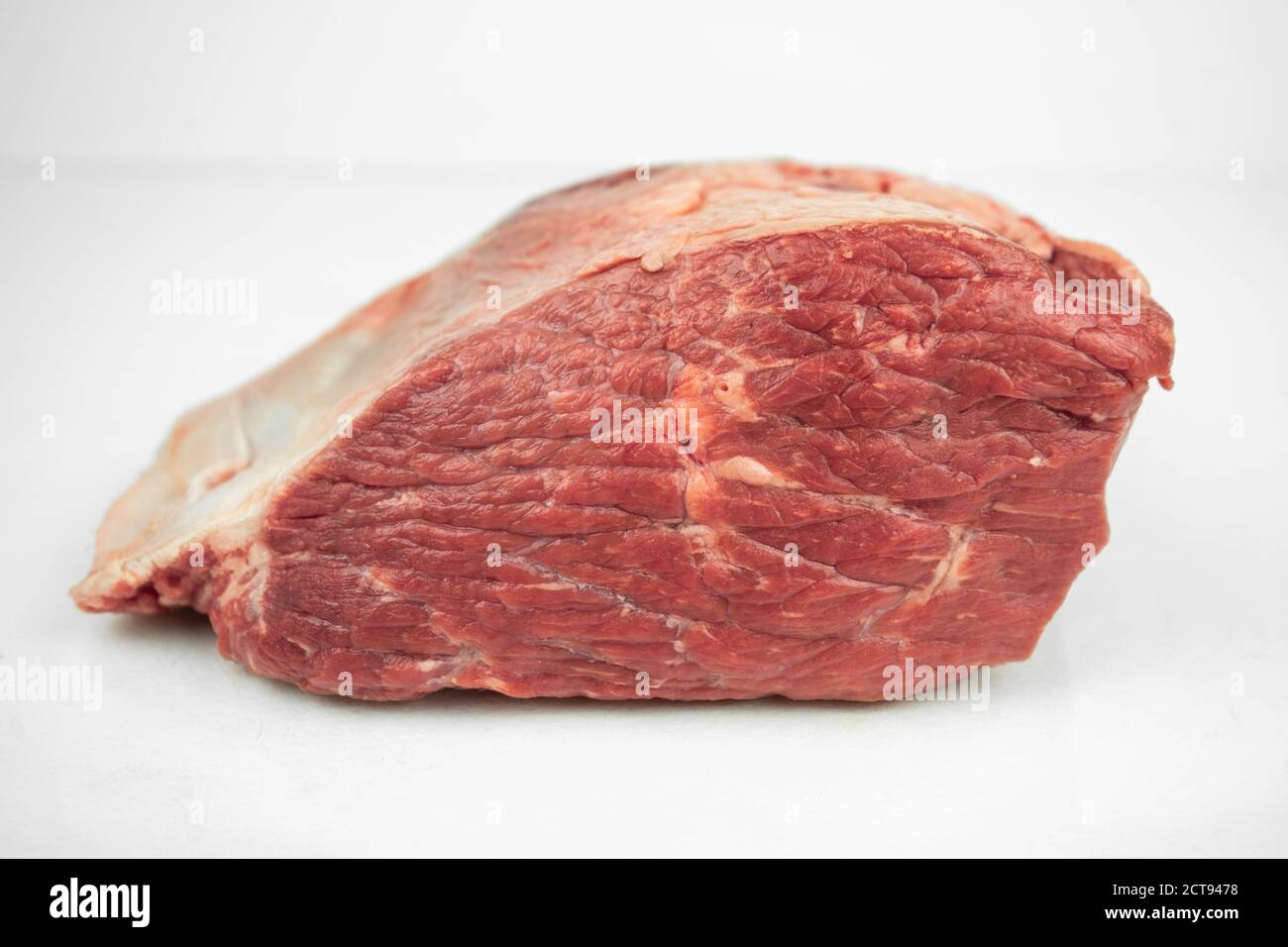 large piece of beef tenderloin, raw meat, isolated on white Stock Photo ...