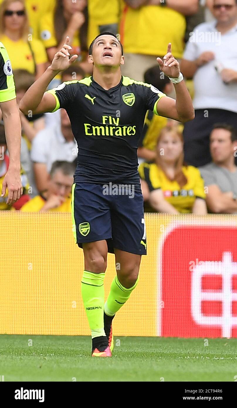 ALEXIS SANCHEZ CELEBRATES SCORING HIS HEADED GOAL FOR ARSENAL AND IT IS CONFIRMED TO HAVE CROSSED THE LINE BY GOAL-LINE TECHNOLOGY  Watford v Arsenal Stock Photo