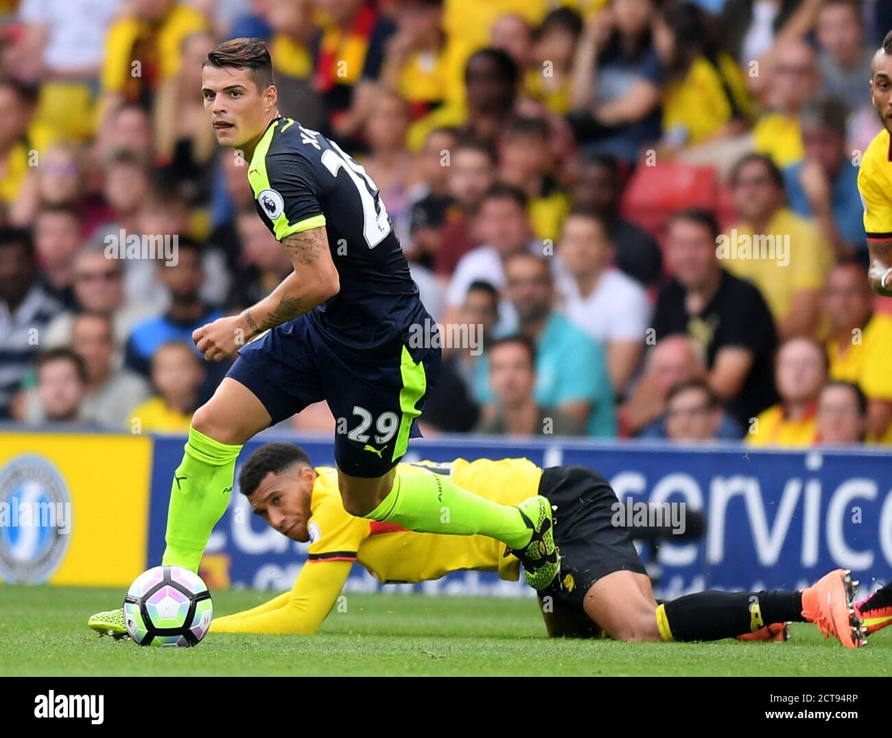 Granit Xhaka tussles with Etienne Capoue  Watford v Arsenal Premier League - Vicarage Road  Copyright Picture : Mark Pain 27/08/2016    PHOTO CREDIT : Stock Photo