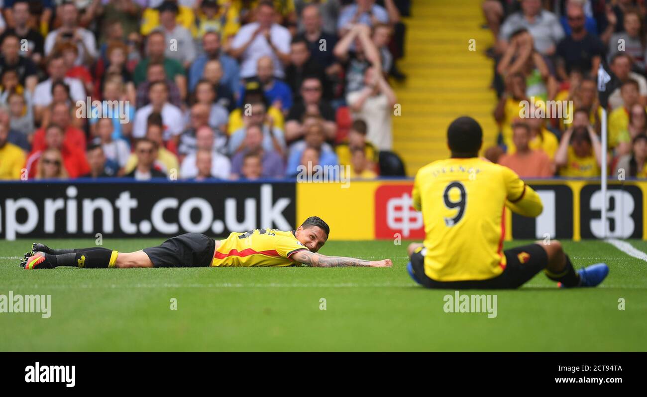 JOSE HOLEBAS AND TROY DEENEY ON THE FLOOR AS THEY MISS ANOTHER GOALSCORING OPPORTUNITY FOR WATFORD   Watford v Arsenal Premier League - Vicarage Road Stock Photo