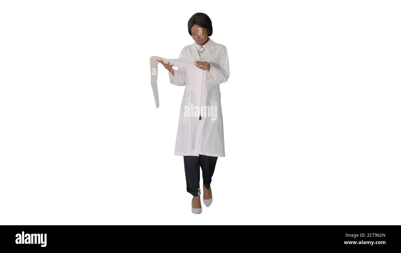 Smiling african american female doctor reading cardiogram on whi Stock Photo