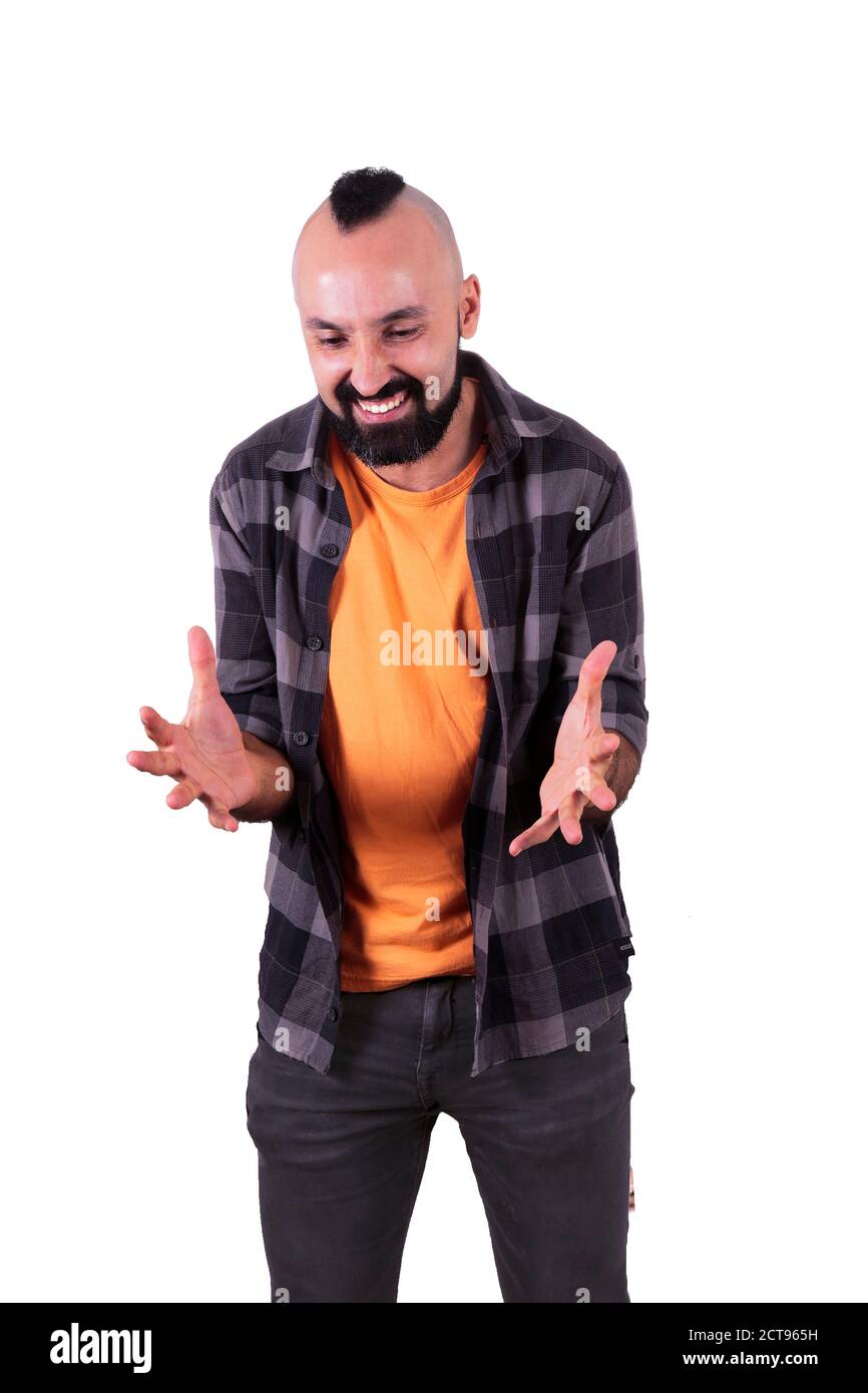 Furious young hispanic man in casual clothes expressing anger Stock Photo