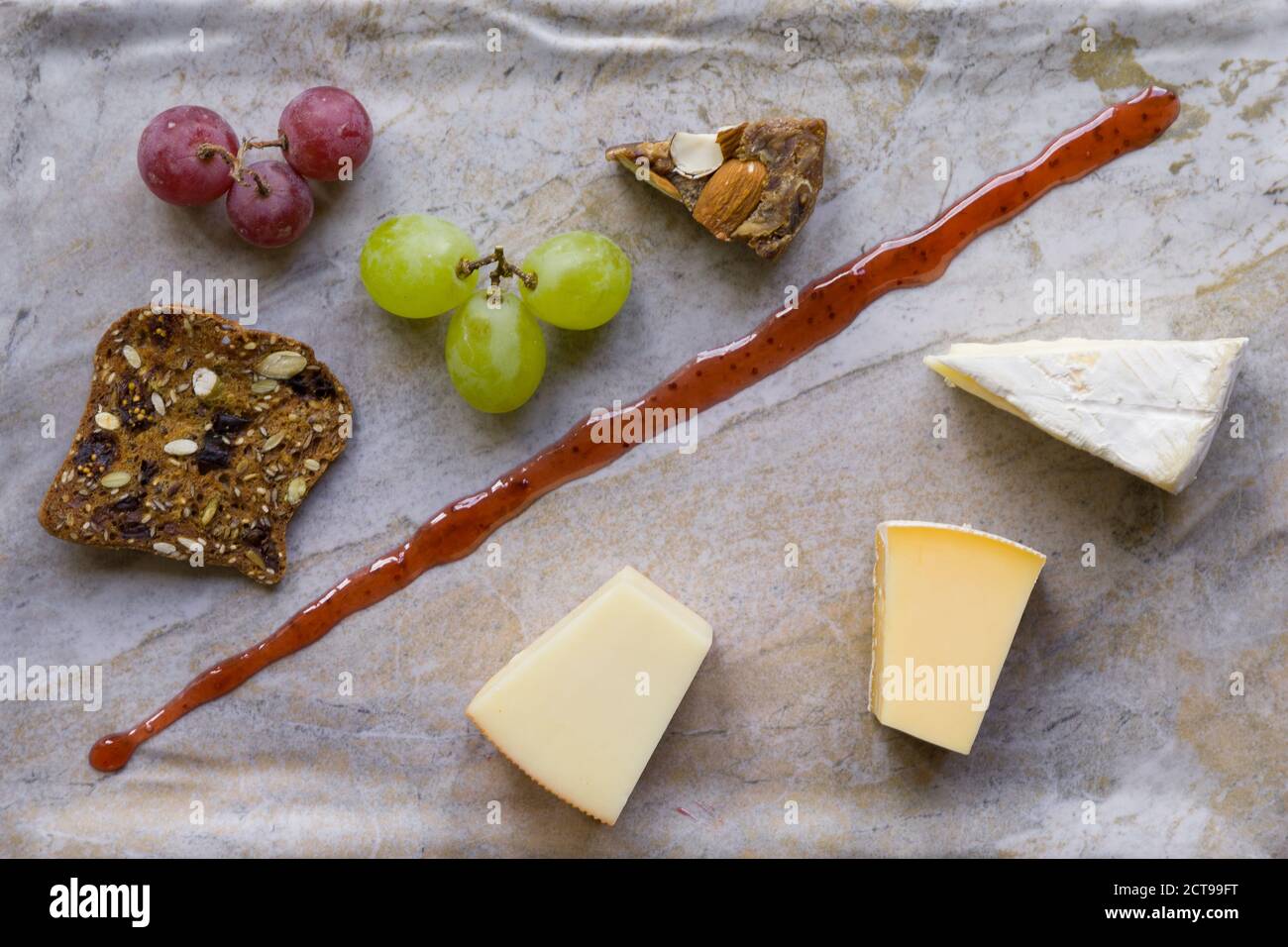 Cheese platter witch assorted cheese and grapes Stock Photo