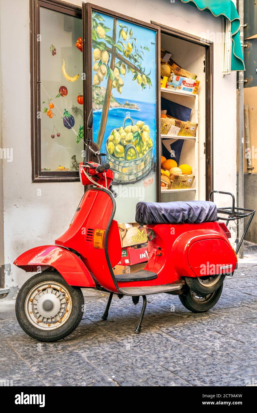 Red Vespa scooter parked in Amalfi, Campania, Italy Stock Photo