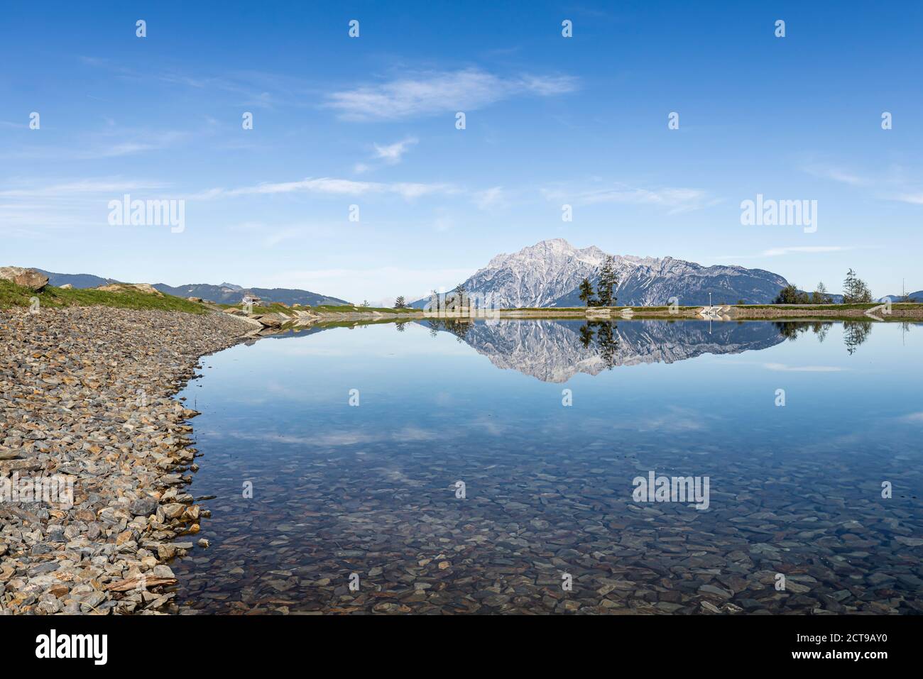 Prinzensee lake in Austria in the region of Hochkoenig Salzburg. The mountains in the background reflect in the mirro surface of the lake. Stock Photo