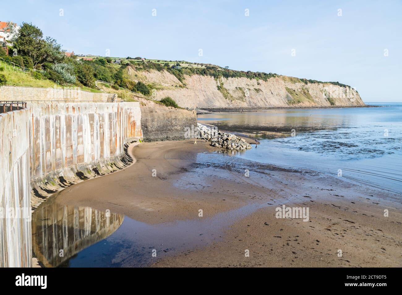 Robin Hoods Bay seawall seen at low tide in North Yorkshire in