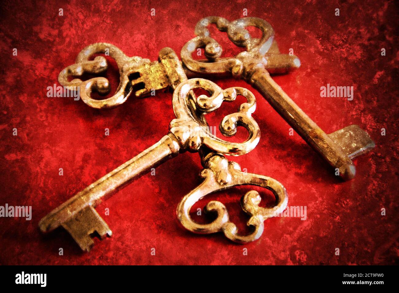 Four vintage keys. Retro aged toned photo with scratches Stock Photo