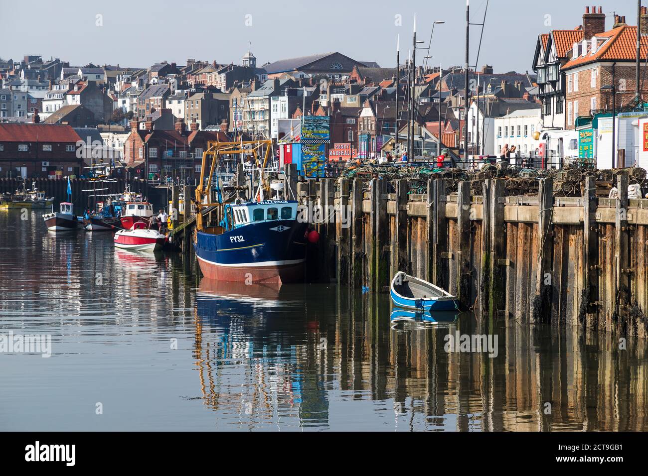 Fishing boats in Scarborough seen at low tide in the harbour in