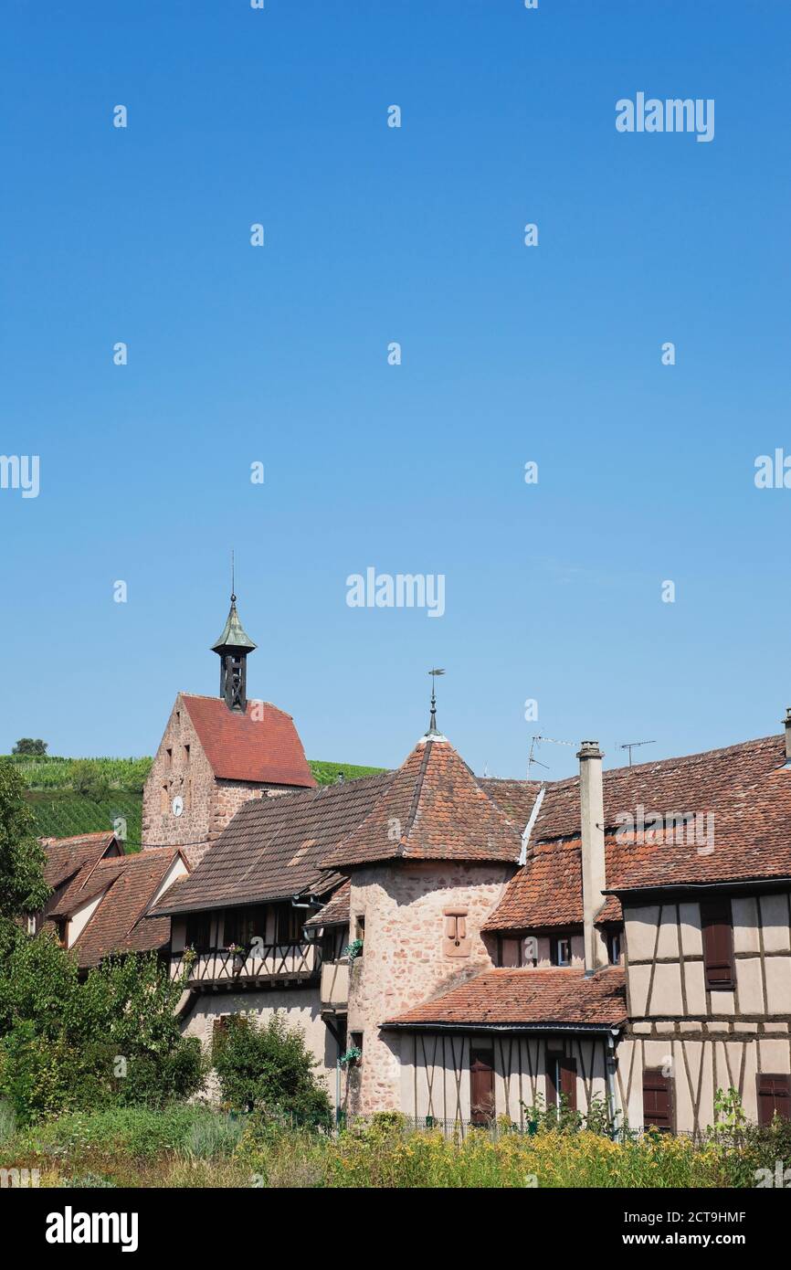 France, Alsace, Riquewihr, Haut-Rhin, Alsatian Wine Route, Riquewihr, Dolder Tower and outside surrounding town wall with integrated houses Stock Photo