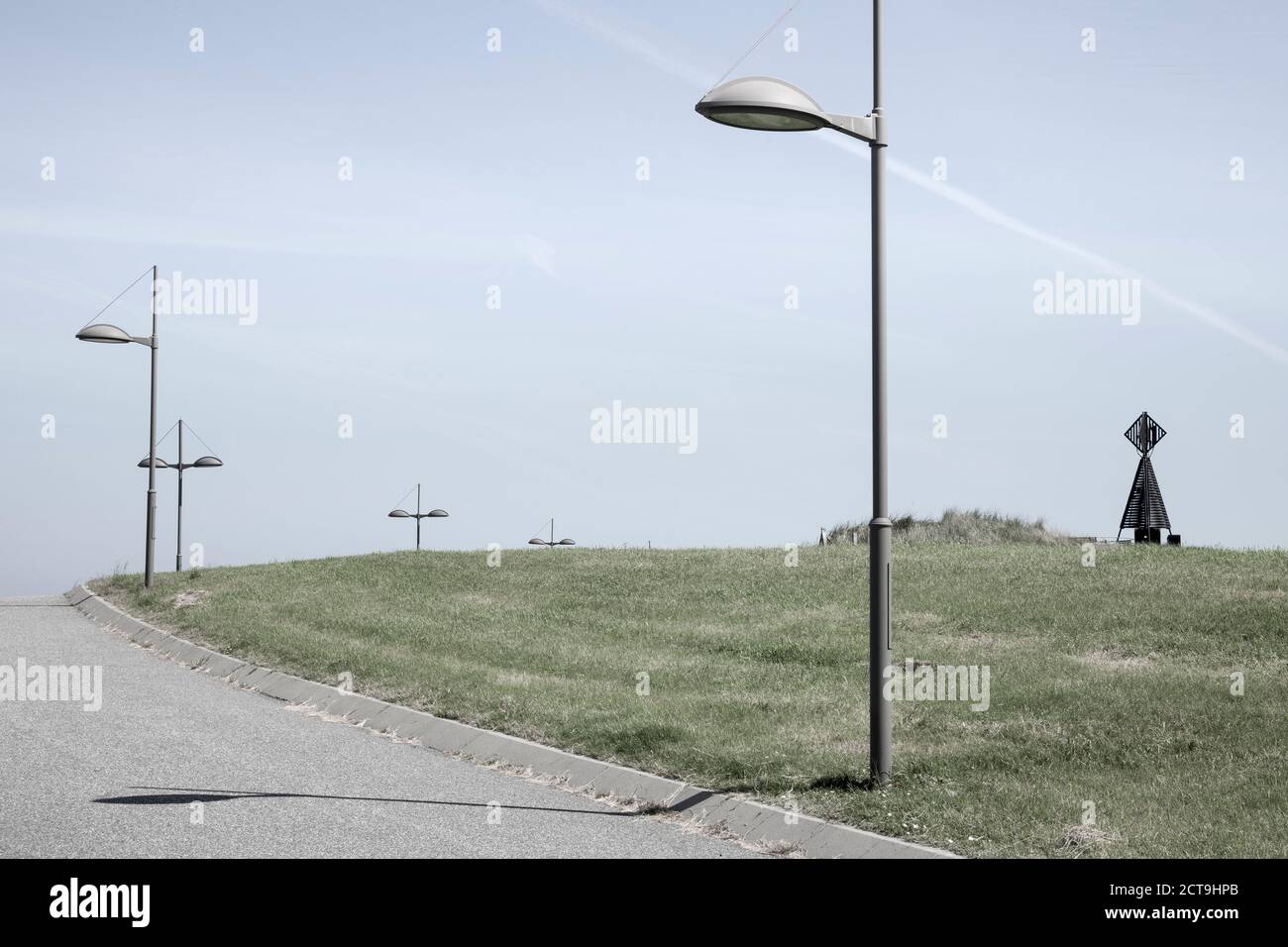 Germany, Lower Saxony, Baltrum, path with streetlamps Stock Photo