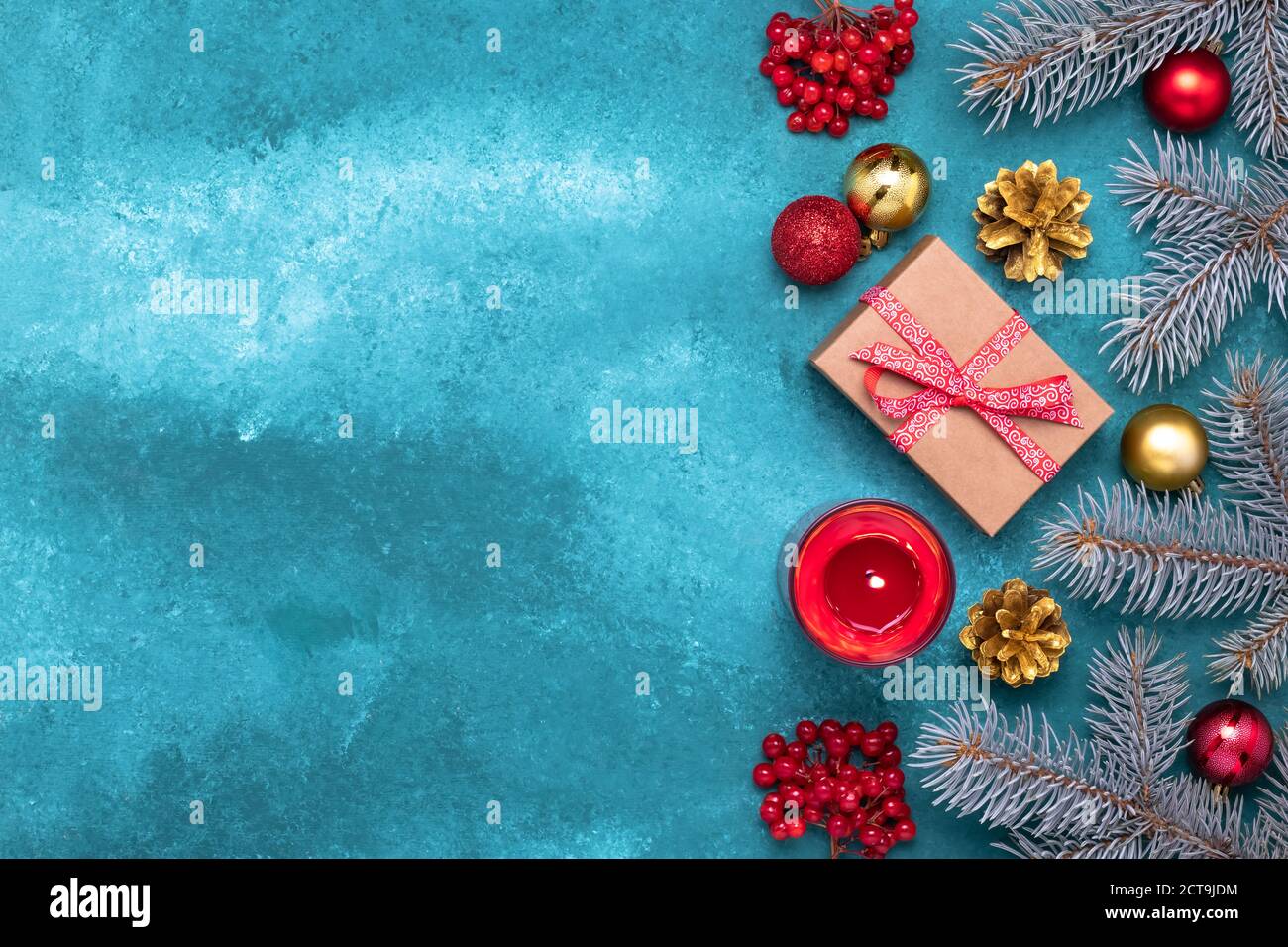 Blue Christmas frame border with spruce tree branches and holiday decorations. Festive template, mockup, copy space for text. New Year greeting card, Stock Photo