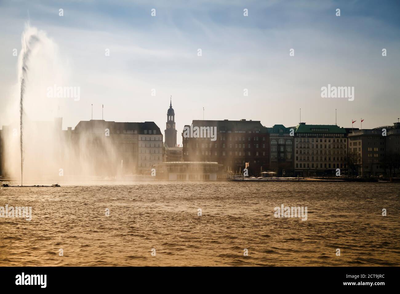 Germany, Hamburg, Inner Alster and Alster fountain, St. Michaelis Church in the background Stock Photo