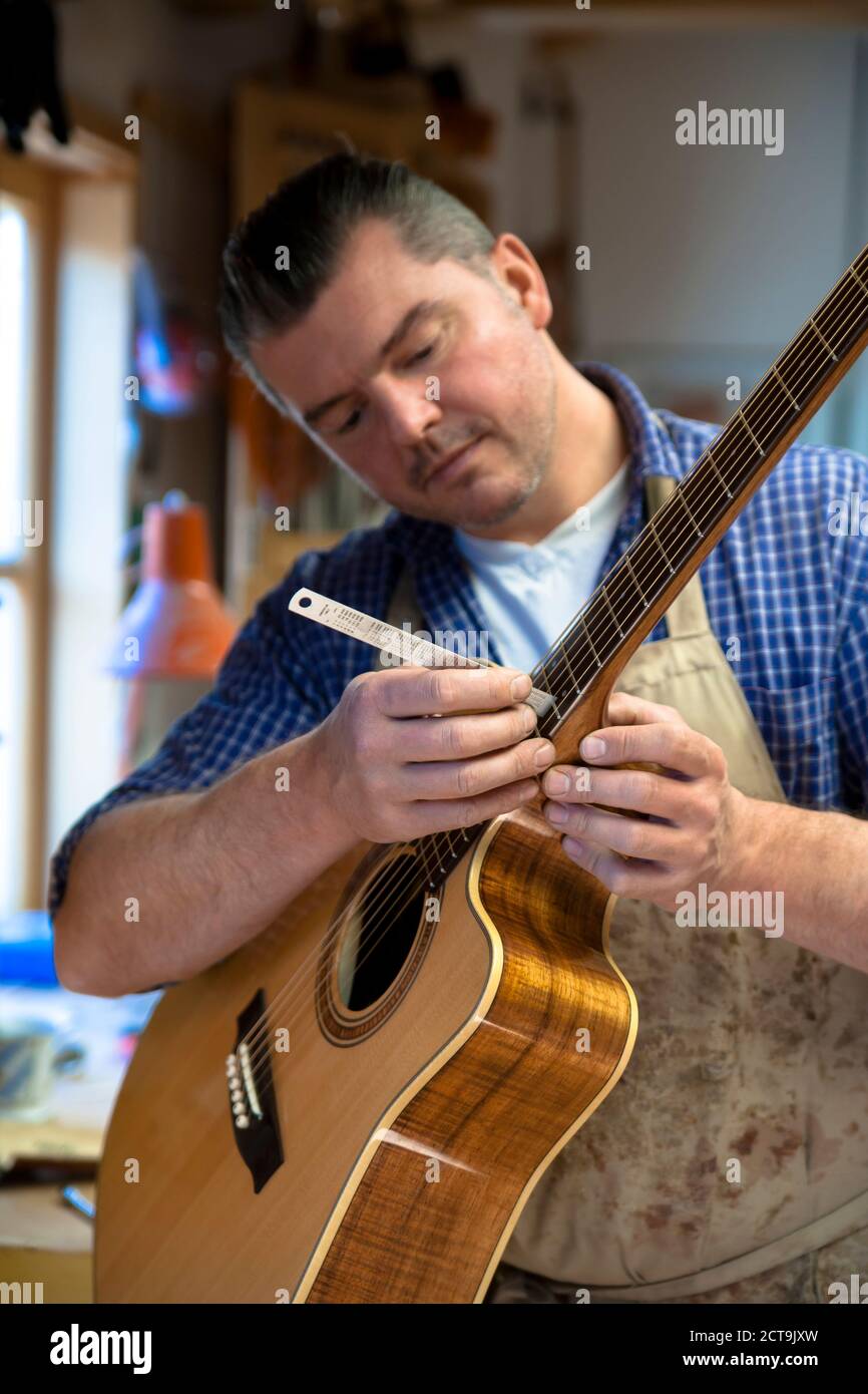 Guitar maker in his Stock Photo Alamy