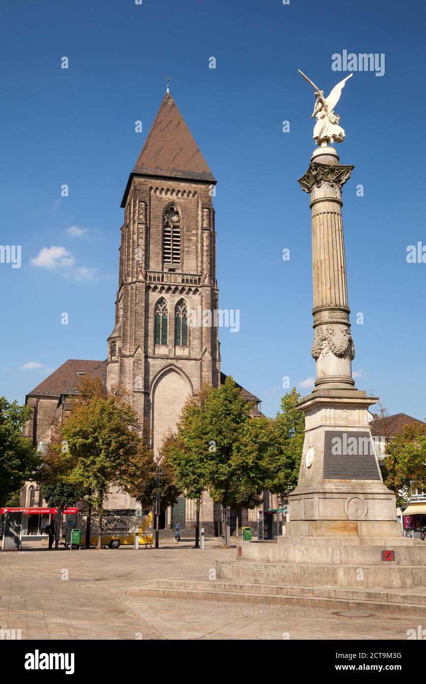 Germany, North Rhine-Westphalia, Oberhausen, Altmarkt, Church of the Sacred Heart, Angel of peace, victory column Stock Photo