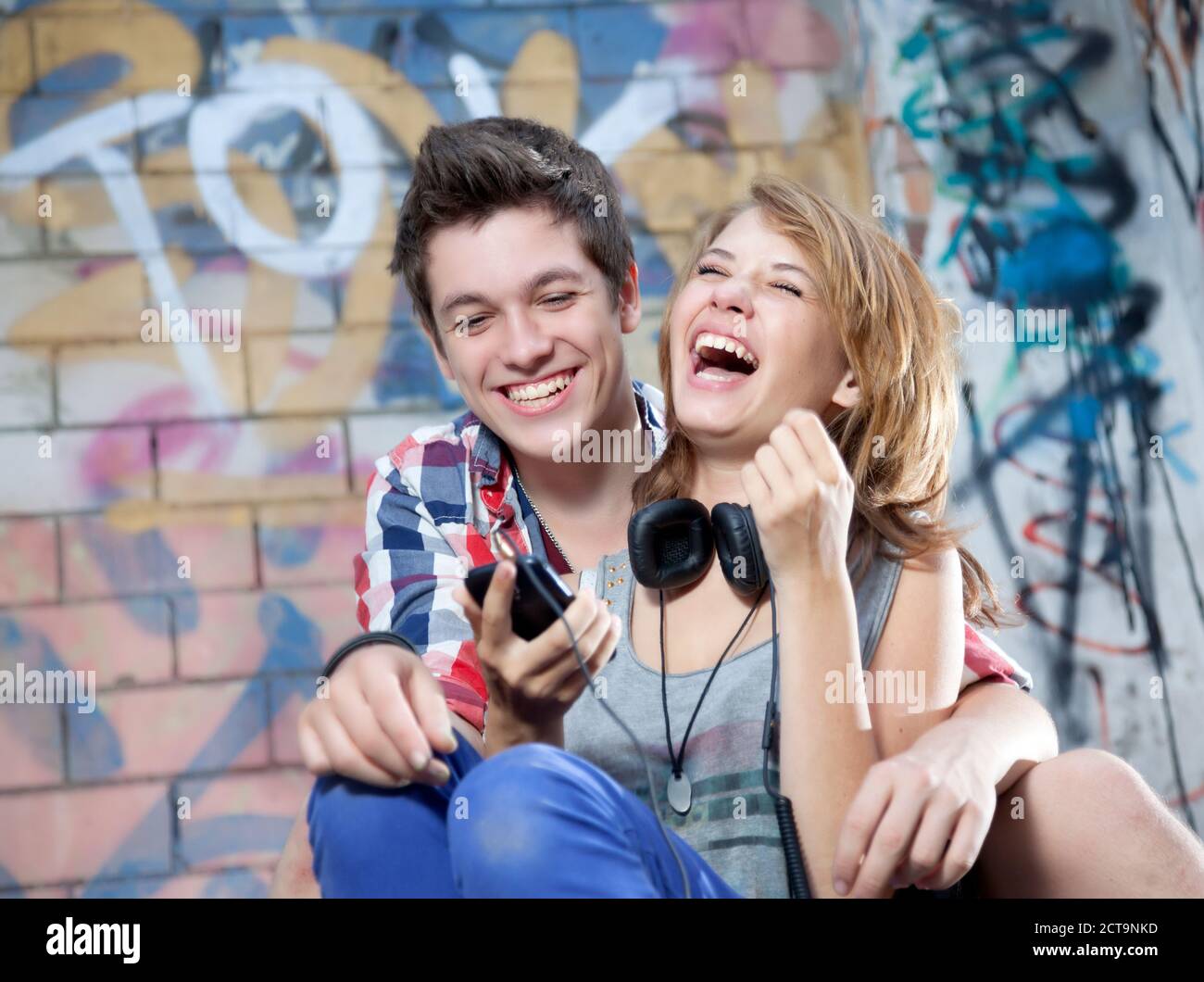 Teenage couple in love cuddling hi-res stock photography and images - Alamy