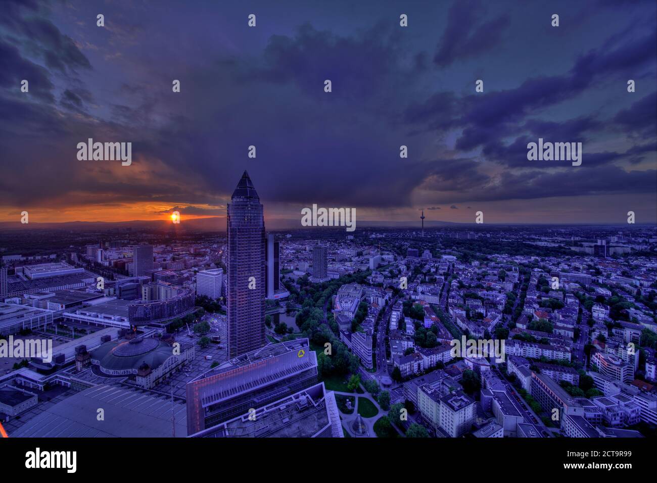 Germany, Hesse, Frankfurt am Main, Trade Fair Tower and city view at sunset Stock Photo