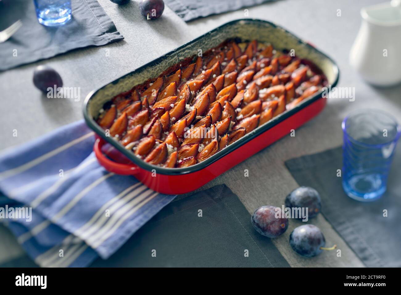 Plum cake in casserole dish Stock Photo