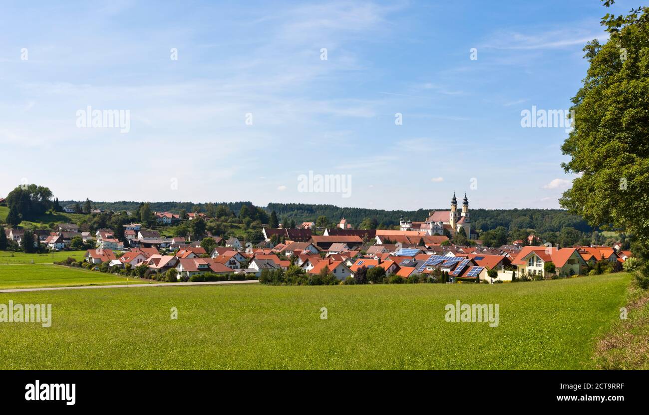Germany, Baden Wuerttemberg, View of house with church of St Verena in background Stock Photo