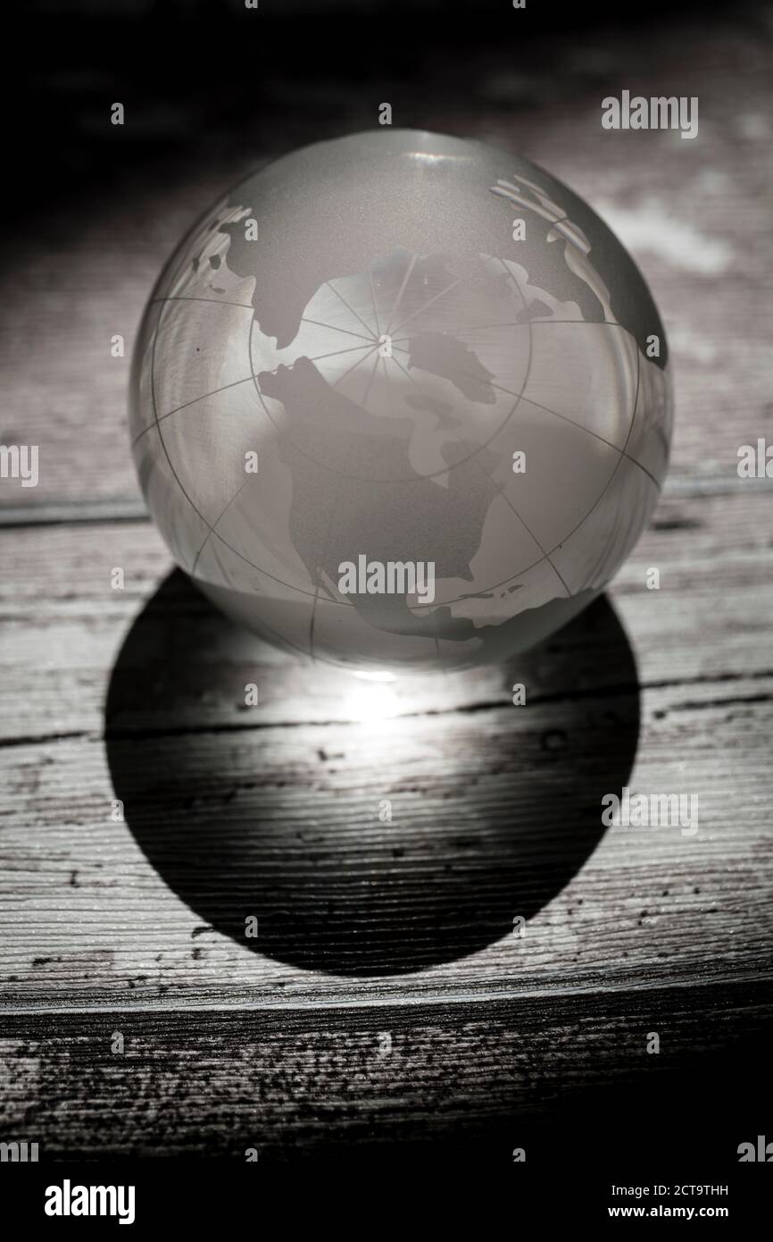 Globe glass ball on wooden ground Stock Photo
