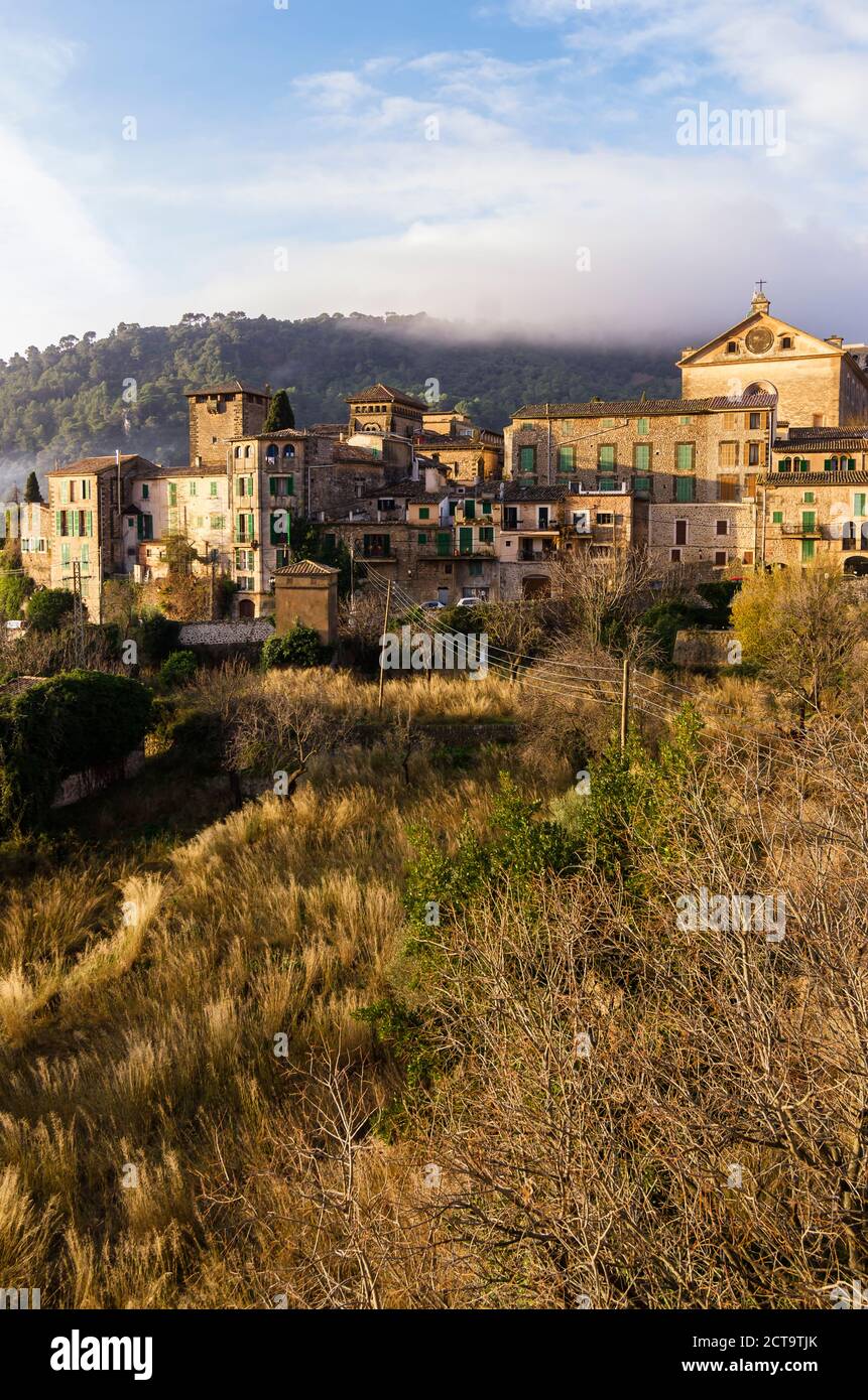 Spain, Balearic Islands, Mallorca, Valldemossa, S'Arxiduc, View to village with chartreuse, Carthusian monastery Stock Photo